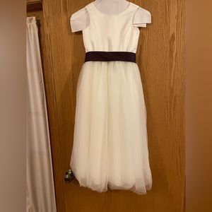 Girl’s bridesmaid dress with purple bow, size 6